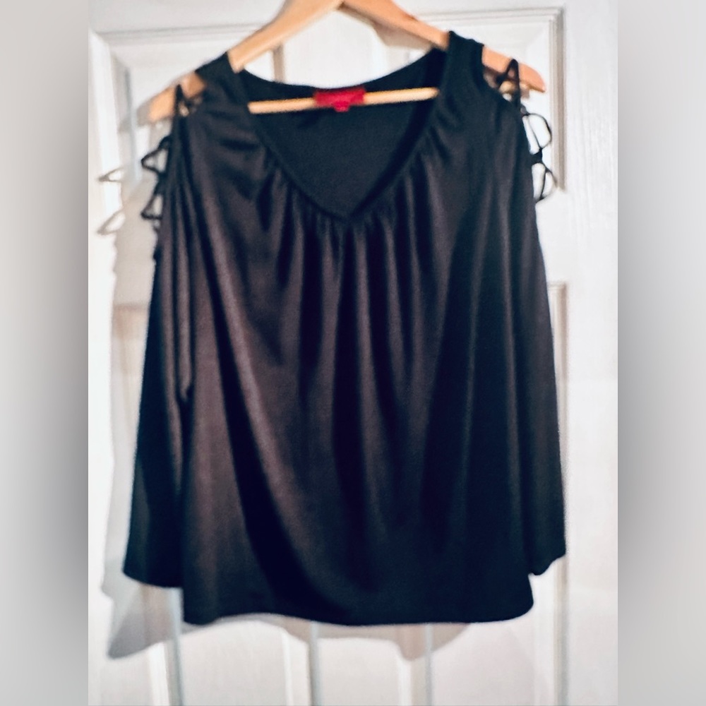 Cool shimmery black top with unique sleeves! Size OX J-Lo brand.